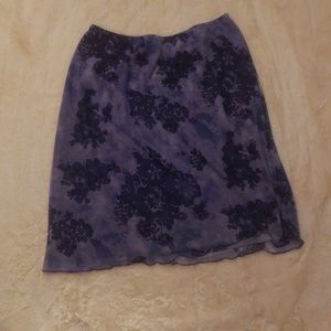 A purple flowered skirt